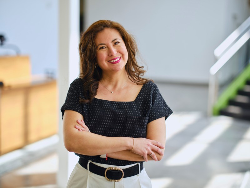 Hispanic woman with medium-length curly hair