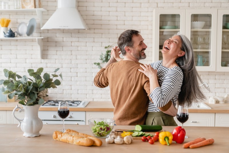 Happy couple dancing in the kitchen