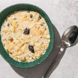 muesli in blue bowl with spoon