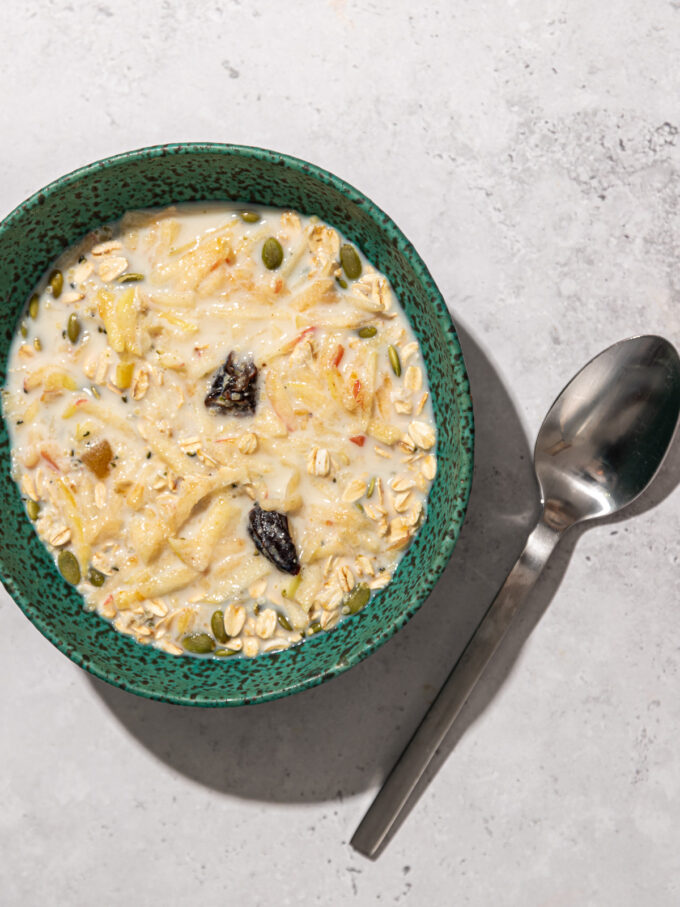 muesli in blue bowl with spoon